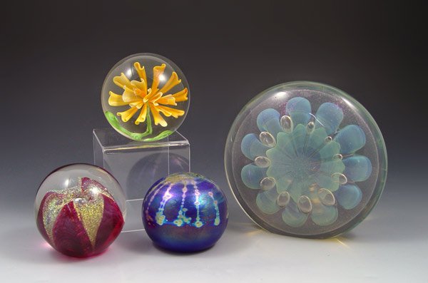 4 ART GLASS PAPERWEIGHTS EICKHOLT FELLERMAN: 4 ART GLASS PAPERWEIGHTS: To include 1) Opalescent with floral and suspended bubble design signed Eickholt 1989. 5 1/2" dia.. 2) Blue opalescent signed Fellerman Studios. 2 3/4" dia. 3) Clear with ora