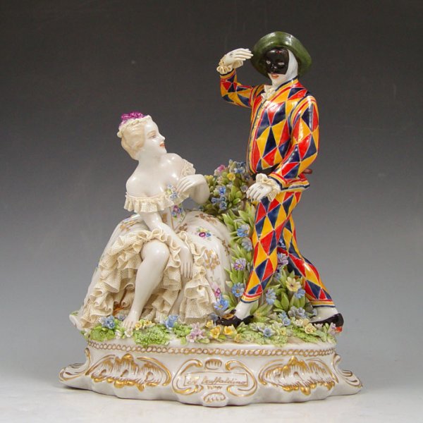 LUIGI FABRIS ITALIAN PORCELAIN FIGURINE Truffaldi: LUIGI FABRIS ITALIAN PORCELAIN FIGURINE PORCELAIN LACY FIGURAL GROUP: Truffaldino or Harlequin figural group. 8 1/2" x 7".