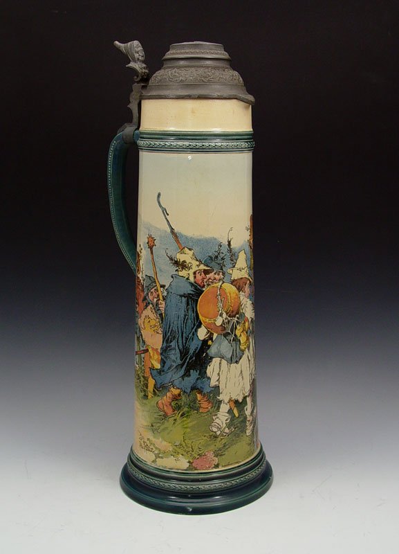 HEINRICH SCHLITT LARGE METTLACH PUG STEIN 2488: HEINRICH SCHLITT LARGE METTLACH PUG STEIN 2488: PUG (Print under glaze) scene of soldiers and villagers. Impressed Mettlach marking. Measures 20" h. x 7 1/2" base dia.
