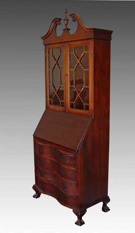 MADDOX DROP FRONT SECRETARY DESK: DIMINUTIVE DROP FRONT SECRETARY DESK BY MADDOX: Double glass door top with wooden shelves over drop desk which hides cubbies and drawers, over four serpentine front drawers, ball and claw feet, broken