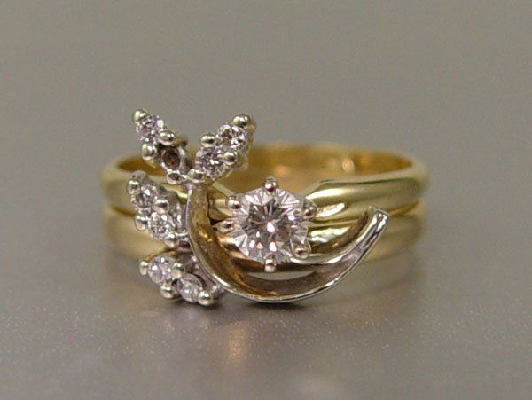UNUSUAL DIAMOND WEDDING RINGS 14K SZ 6: 14K DIAMOND TWO PIECE BRIDAL SET: 14K yellow gold bridal set contains eight round brilliant cut diamonds. Weight: .25 Ct. Approx. One diamonds is missing. The diamonds average SI in clarity and I-J in