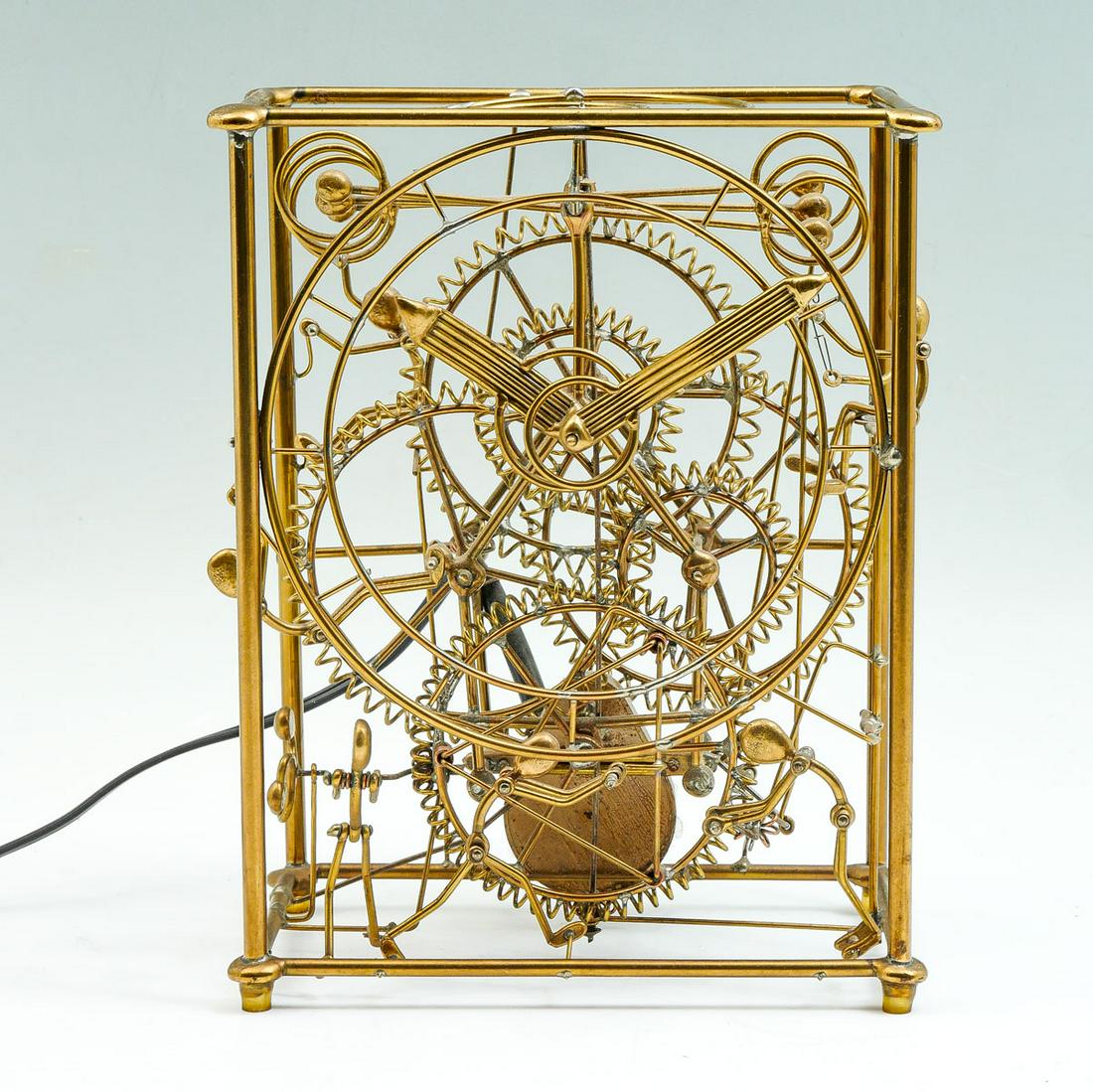 KINETICO STUDIOS SIX MAN CLOCK: KINETICO STUDIOS SIX MAN CLOCK: Six-man kinetic sculpture clock with moving figures as clock runs. Designed by Gordon Brandt. Approx. 9.25" h x 7.25" l x 4.5" w.