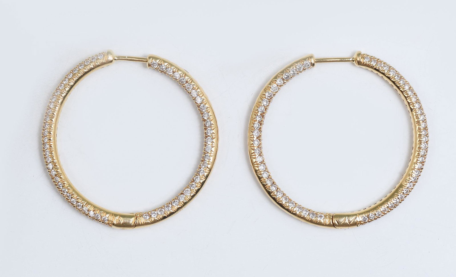 18K 2.00 CTW DIAMOND HOOP EARRINGS: 18K 2.00 CTW DIAMOND HOOP EARRINGS: 18K yellow gold hoop earrings contain 250 round brilliant cut diamonds. WEIGHT: 2.00 Ct. Approx. Rated VS in clarity and G-H in color. The diamonds are micro-pave' 