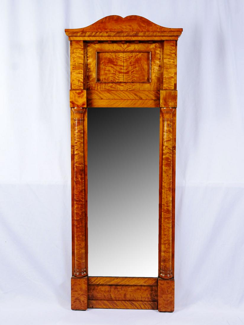 EARLY GERMAN FLAME BIRCH BIEDERMEIER MIRROR: EARLY GERMAN FLAME BIRCH BIEDERMEIER MIRROR: Bavarian Flame Birch Biedermeier mirror, flanked by half columns. Original paper tag at verso. Approx. 64.75'' h x 25'' l x 3.25'' w.