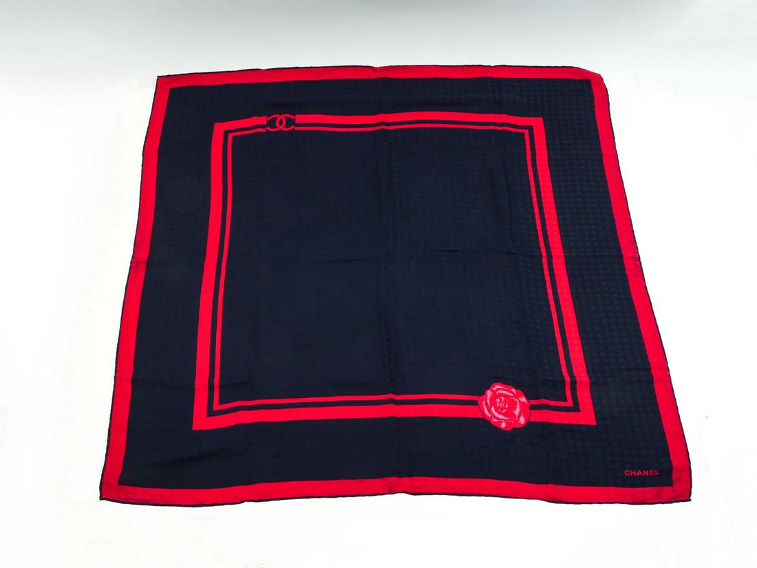 VINTAGE CHANEL NAVY BLUE & RED CC EMBOSSED SCARF: VINTAGE CHANEL NAVY BLUE & RED CC EMBOSSED SCARF: Beautiful sought after Chanel scarf with embossed CC throughout the design. Measures approximately 33'' square.