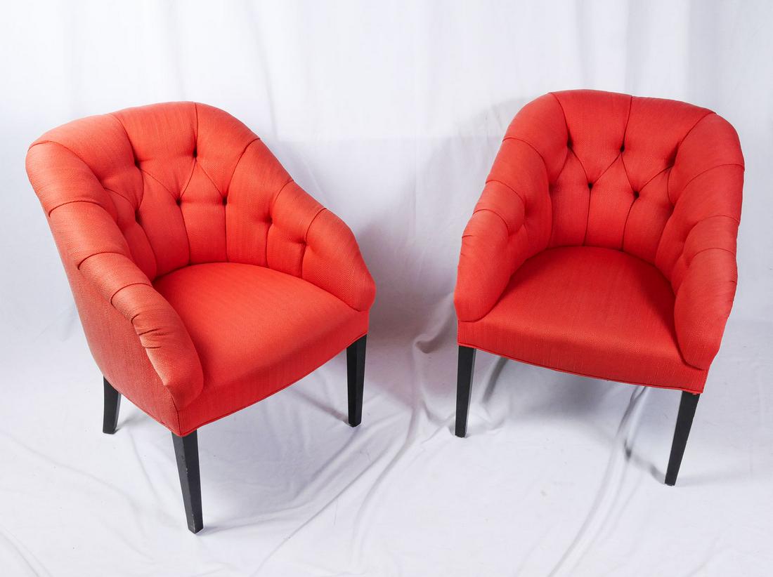 PAIR OF JOHN BOONE BUTTON TUFTED ARMCHAIRS: PAIR OF JOHN BOONE BUTTON TUFTED ARMCHAIRS: Red upholstered button tufted barrel chairs, raised on ebonized tapered square feet. John Boone cloth tags at undersides. Approx. 35.75'' h x 27.75'' l x 30