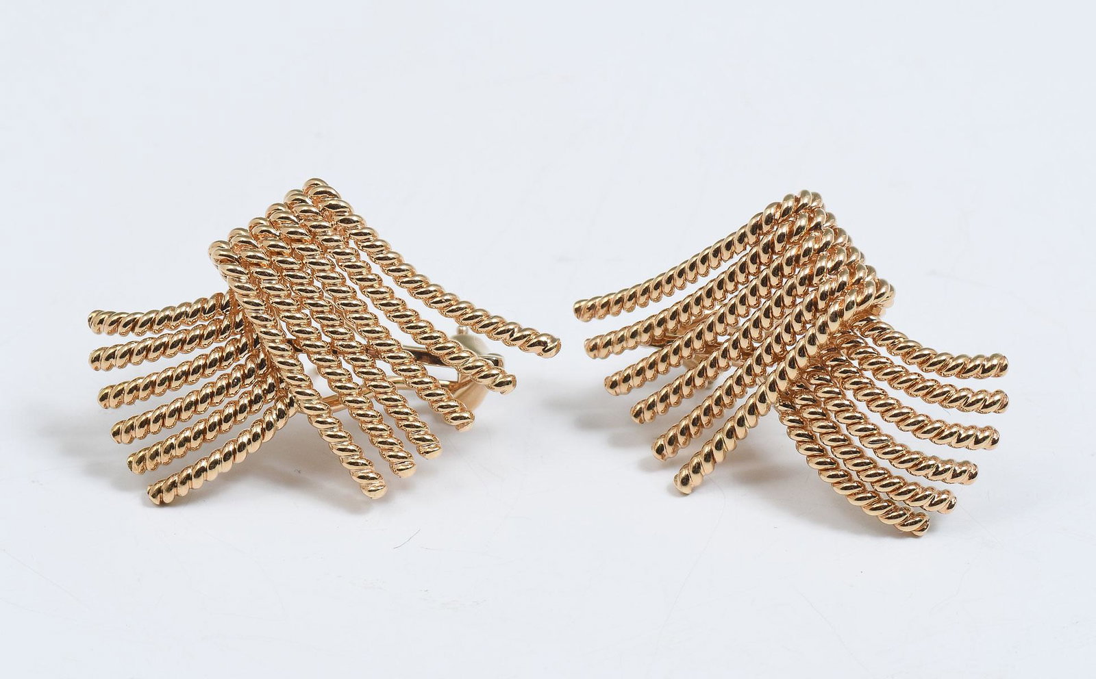 18K SCHLUMBERGER FOR TIFFANY & CO. ROPE 'V' EARRINGS: 18K SCHLUMBERGER FOR TIFFANY & CO. ROPE 'V' EARRINGS: Iconic vintage pierced earrings designed by Jean Schlumberger for Tiffany & Co. Crafted in 18K featuring the retired 'V' shaped fan design in twis
