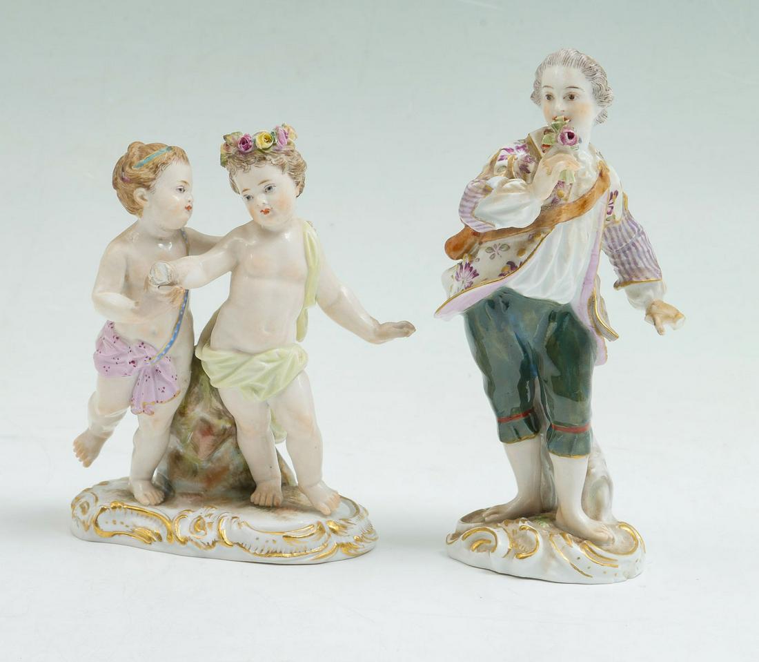 2 MEISSEN PORCELAIN FIGURES: 2 MEISSEN PORCELAIN FIGURES: Comprising; 1- Male figure with flowers, & 1- Figure of two playful children. Both have the crossed sword mark at undersides. Largest Approx. 5.25'' h x 2.5'' w.