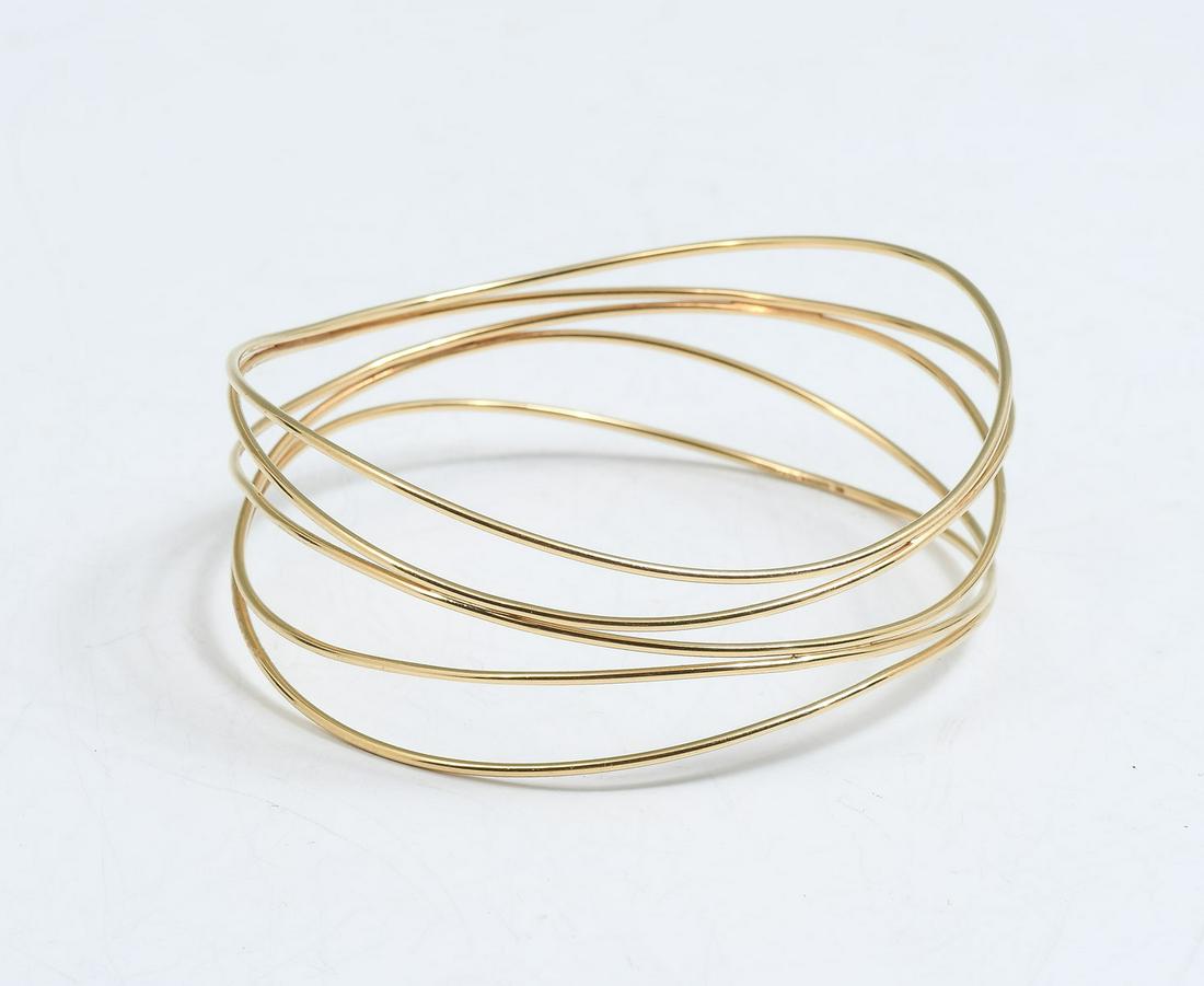 TIFFANY & CO ELSA PERETTI 18K 5 WAVE BRACELET: TIFFANY & CO ELSA PERETTI 18K 5 WAVE BRACELET: This graceful piece by Elsa Peretti for Tiffany & Co is 18K yellow gold and features 5 slender gold wires that form a wider bangle. Marked Tiffany & Co P