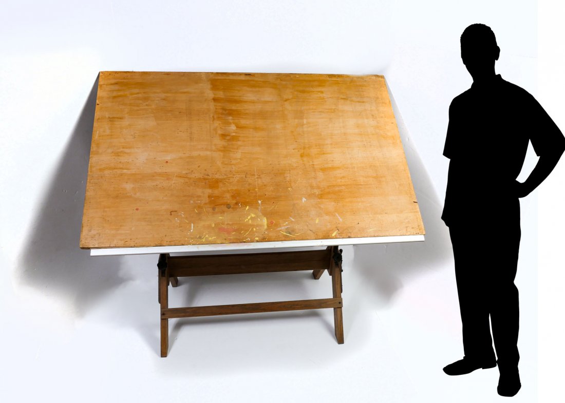 HAMILTON DRAFTING TABLE: HAMILTON DRAFTING TABLE: Hamilton Mfg. Co. Cast iron and wood drafting table with removable top that has a metal lower edge. Circa 1920's. Metal tag at stretcher. Approx. 32.5'' h x 32'' l x 26'' w.