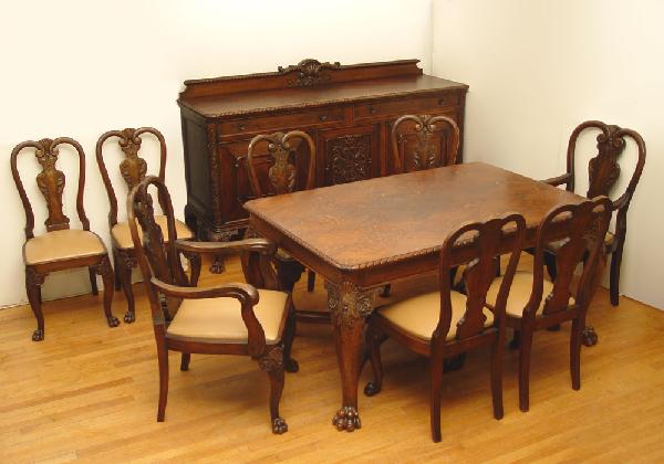 LATE VICTORIAN CARVED OAK DINING TABLE & 8 CHAIRS: LATE VICTORIAN BALL AND CLAW OAK DINING TABLE AND 8 CHAIRS. Elements of Queen Anne and Chippendale design. The table with harlequin inlaid diamond pattern top, rope carved edging, straight apron, and