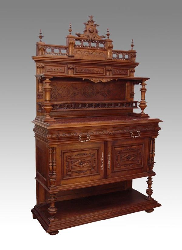 EDWARDIAN CARVED WALNUT SIDE CABINET: EDWARDIAN CARVED WALNUT SIDE CABINET: Elaborately detailed with turnings, carvings, and cut work. The top with shelf, plate rail, finials, and shell carvings. Lower base with red marble top, full leng