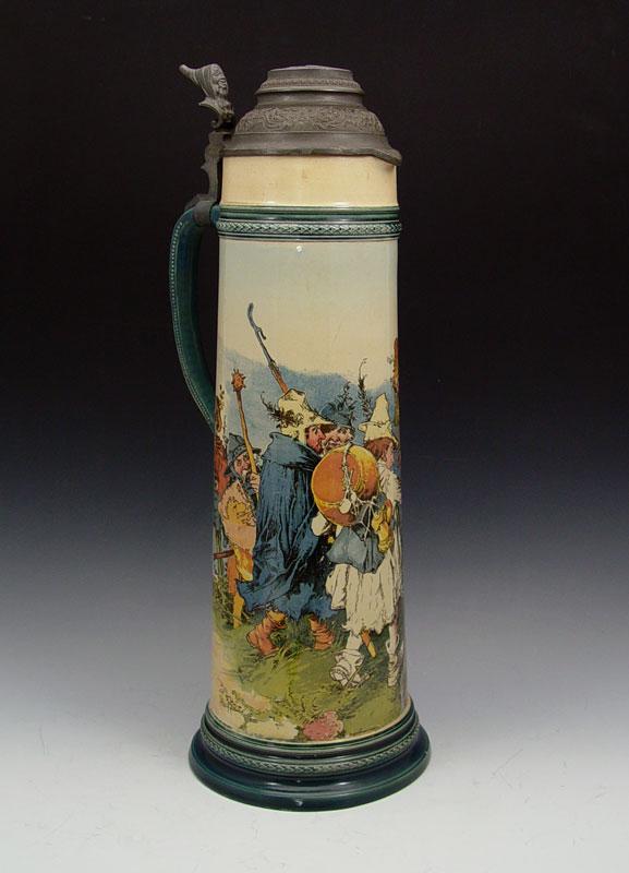 HEINRICH SCHLITT LARGE METTLACH PUG STEIN 2488:: HEINRICH SCHLITT LARGE METTLACH PUG STEIN 2488: PUG (Print under glaze) scene of soldiers and villagers. Impressed Mettlach marking. Measures 20'' h. x 7 1/2'' base dia.