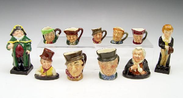 ROYAL DOULTON MINI TINY MUGS BUSTS FIGURES 11 PCS: 11 ROYAL DOULTON FIGURES AND MUGS: Tiny Mugs approx. 1 3/8''h. - Fat Boy, The Cardinal, Sam Weller, Old Charlie, Sairey Gamp; and Mini Mugs approx. 2 1/4''h. - Sam Weller, Mr. Micawber. Figural busts 
