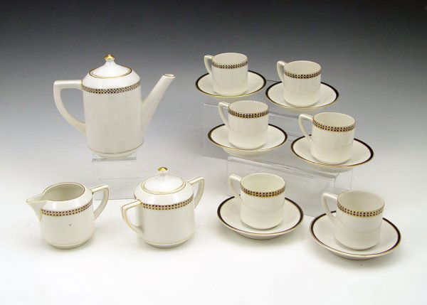 NIPPON HAND PAINTED CHILDS TEA SET: NIPPON HAND PAINTED CHILDS TEA SET: Rising sun mark. To include 5" pot, creamer, sugar, 6 cups & saucers. (one crack).