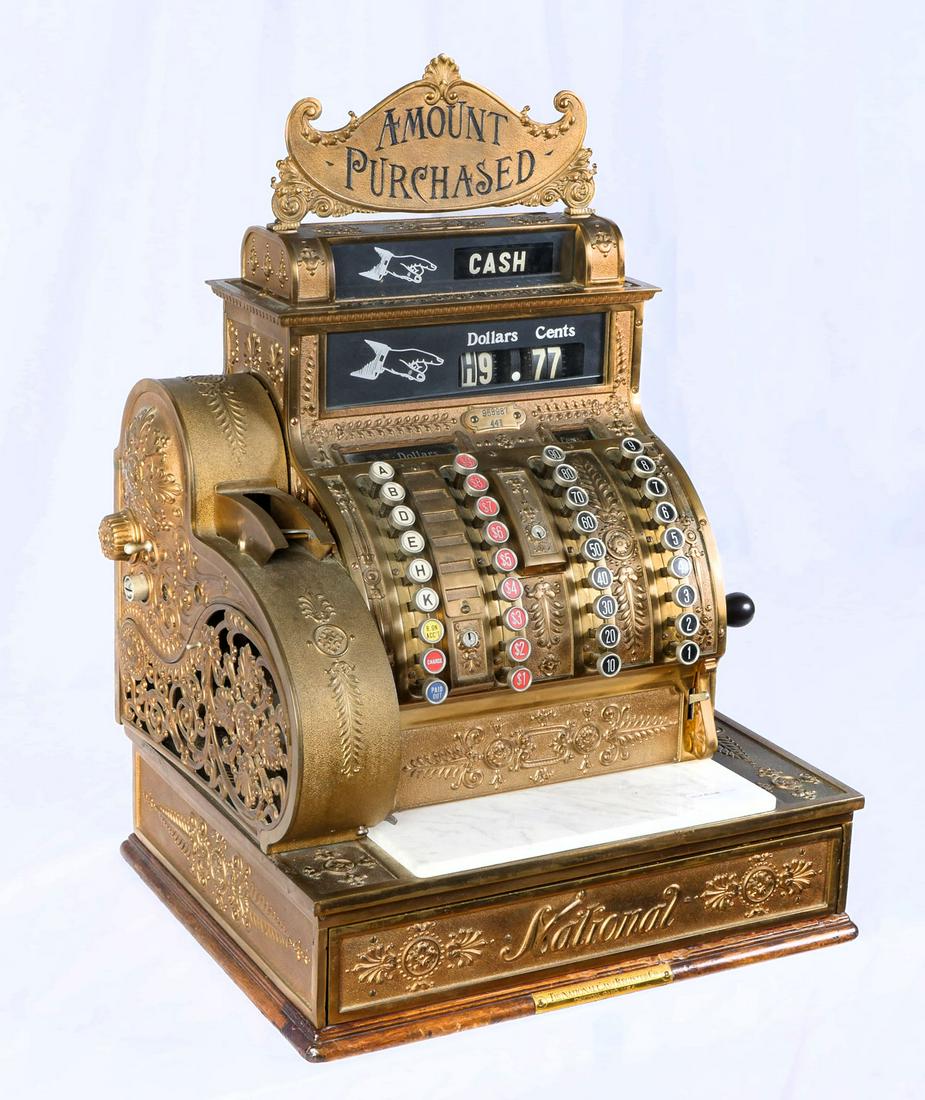 ANTIQUE NATIONAL CASH REGISTER: ANTIQUE NATIONAL CASH REGISTER: Model # 441, Serial #958987. Overall scrolling foliate motif, pierced receipt cage. Marble slab above drawer. Approx. 26.25" h x 18.75" l x 15.75" w.