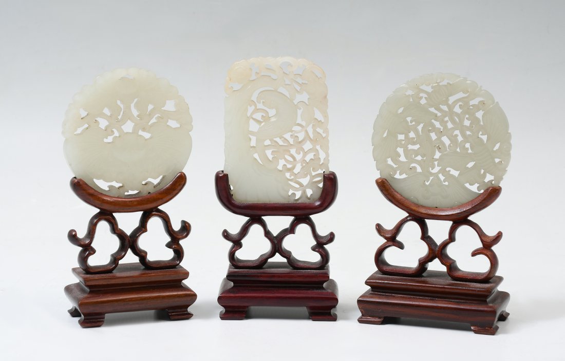 3 PC. CARVED CHINESE JADE PENDANTS ON STANDS: 3 PC. CARVED CHINESE JADE PENDANTS ON STANDS: Comprising; 3- Celadon jade pendants, with carved & pierced Auspicious symbols such as, Butterflies, Bats, Flowers, & a bird perched amongst foliate. All 