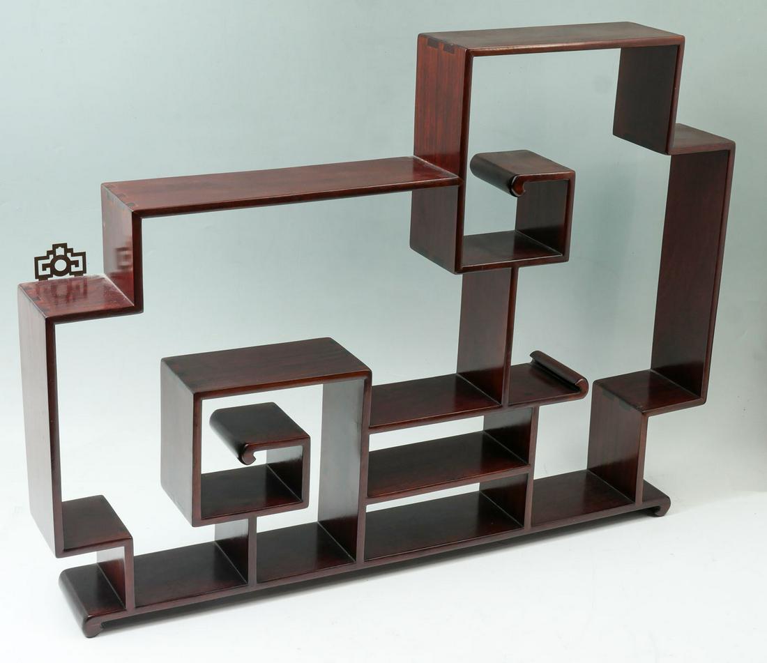 3 PC. CHINESE WOODEN DISPLAYS: 3 PC. CHINESE WOODEN DISPLAYS: Comprising; 1- Rosewood scrolling wall display, 1- Hexagonal display with 2 drawers, 1- Round display with single drawer. Largest Approx. 21.75" h x 29.75" l x 4" w.