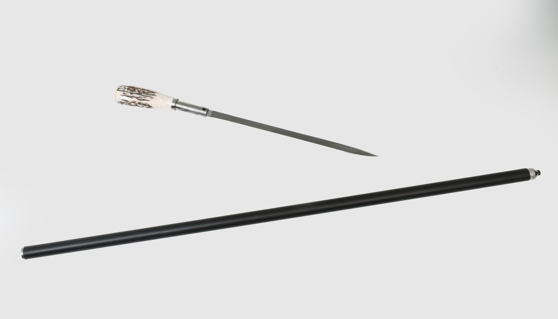 HORN HANDLED HIDDEN SWORD CANE: HORN HANDLED HIDDEN SWORD CANE: Horn handled cane with a hidden sword, etched Crawford, on blade. Rubber attached at bottom to protect original. Approx. 38" l. Blade Approx. 12" l.