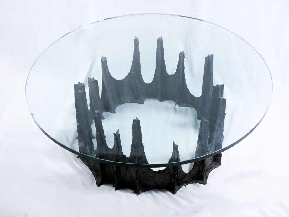 PAUL EVANS BRUTALIST COFFEE TABLE: PAUL EVANS BRUTALIST COFFEE TABLE: Paul Evans Brutalist coffee table, round glass top, metal stalagmite base, 16.5" h x 42" dia. Signed at interior in casting.