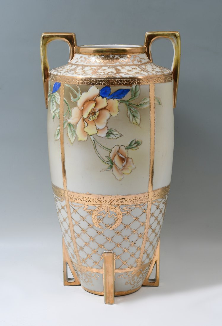 LARGE NIPPON PORCELAIN FLORAL VASE: LARGE NIPPON PORCELAIN FLORAL VASE: Tall double handled vase, having a hand-painted floral motif with a raised wreath, floral, & geometrical design. Stamp at underside. Approx. 18" h x 9.25" w.