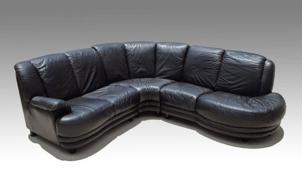ITALIAN BLACK LEATHER SECTIONAL SOFA: ITALIAN BLACK LEATHER SECTIONAL SOFA: Three piece sectional with rounded open end, Made in Italy. Measurements - Overall 35"h. x 93" x 88" x 36" deep, Couch 48", Corner 56" point to point, Open ended