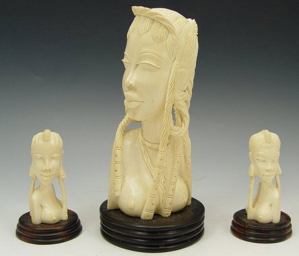 3 AFRICAN IVORY CARVED BUSTS: 3 AFRICAN IVORY CARVED BUSTS: 1) A 7 1/2" beauty carved from one piece, mounted on wood base. 2) Female bust, 3 1/4", on wood base. 3) Female bust, 3 1.4", also on a wood base. The measurements do not