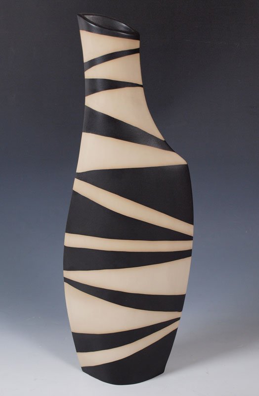 ZEBRA STRIPED POTTERY VASE STAMPED GERMANY: ZEBRA STRIPED POTTERY VASE STAMPED GERMANY: Impressed mark with 2 stars and Germany. Measures 23 1/4" h. x 8 1/4". 3 1/4".