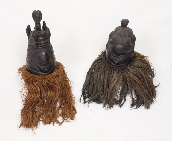 PAIR MENDE TRIBE SANDE WOMANS TRIBAL HEAD MASKS: PAIR MENDE TRIBE SANDE WOMANS TRIBAL HEAD MASKS: Sierra Leone region "helmet" mask for female members. Each mask with grass / fiber collar. Acquired in the 1960's in Africa directly from the tribe. 19
