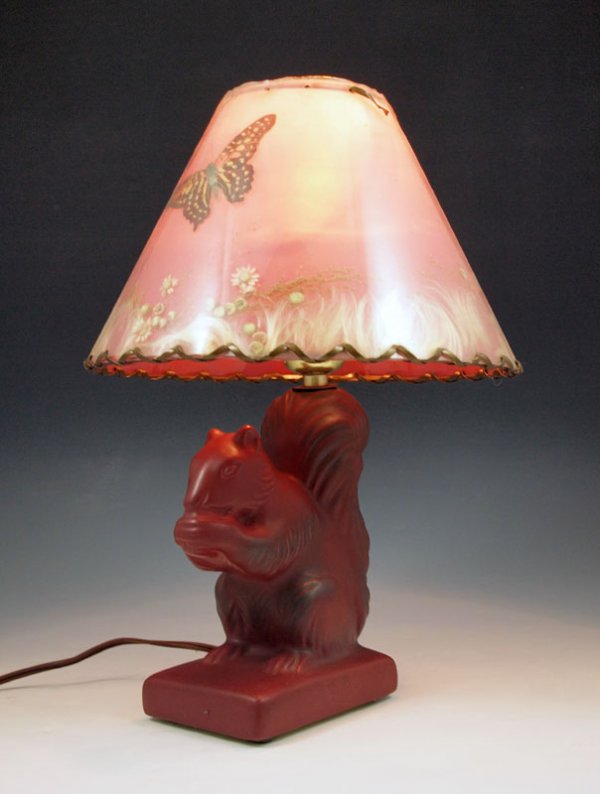 VAN BRIGGLE POTTERY FIGURAL SQUIRREL LAMP: VAN BRIGGLE POTTERY FIGURAL SQUIRREL LAMP: Persian Rose, with original shade. Squirrel is 6 1/2", the lamp is 13" overall.