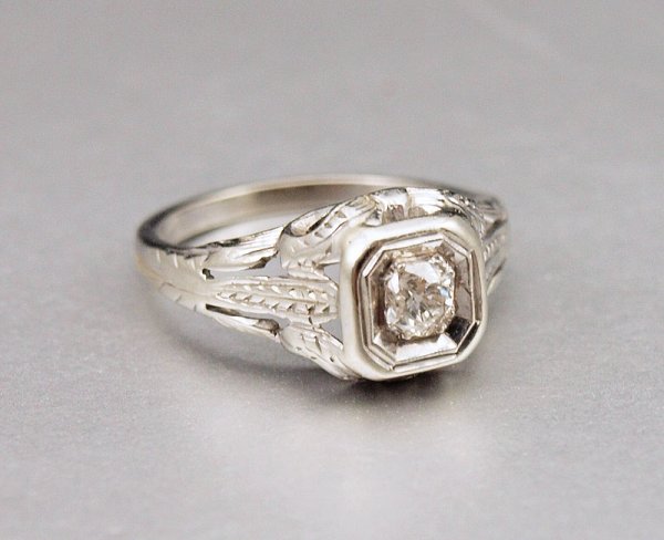 14K OLD MINE DIAMOND SOLITAIRE RING SIZE 4 : 14K OLD MINE DIAMOND SOLITAIRE RING: 14K white gold diamond ring contains one old mine cut diamond. Weight: .20 Ct. Approx. Rated SI in clarity and H-I in color. Weight: 2.4 grams. Size: 4