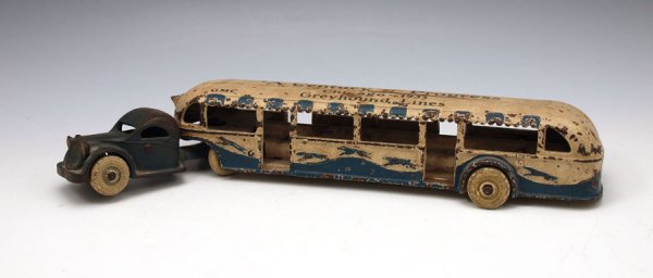 ARCADE CENTURY OF PROGRESS GREYHOUND TOY BUS: ARCADE CENTURY OF PROGRESS TOY BUS: Rarer extended bus with 3 center greyhounds. Solid body. Original as found condition. 2 1/4" h. x 14 1/4".