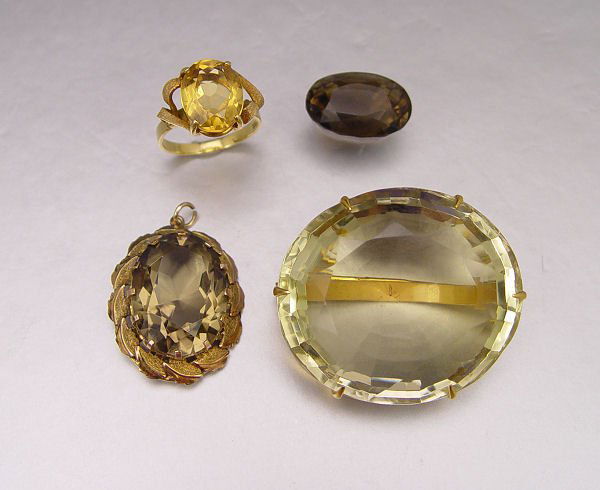4 PC 148 CTW CITRINE & SMOKY QUARTZ JEWELRY: ESTATE CITRINE AND SMOKY QUARTZ JEWELRY 148 CTW: 1) 21K brooch contains an approx. 100 Ct oval citrine. 2) 14K pendant contains oval smoky quartz, approx. 20 Ct. 3) 18K ring contains oval citrine, app