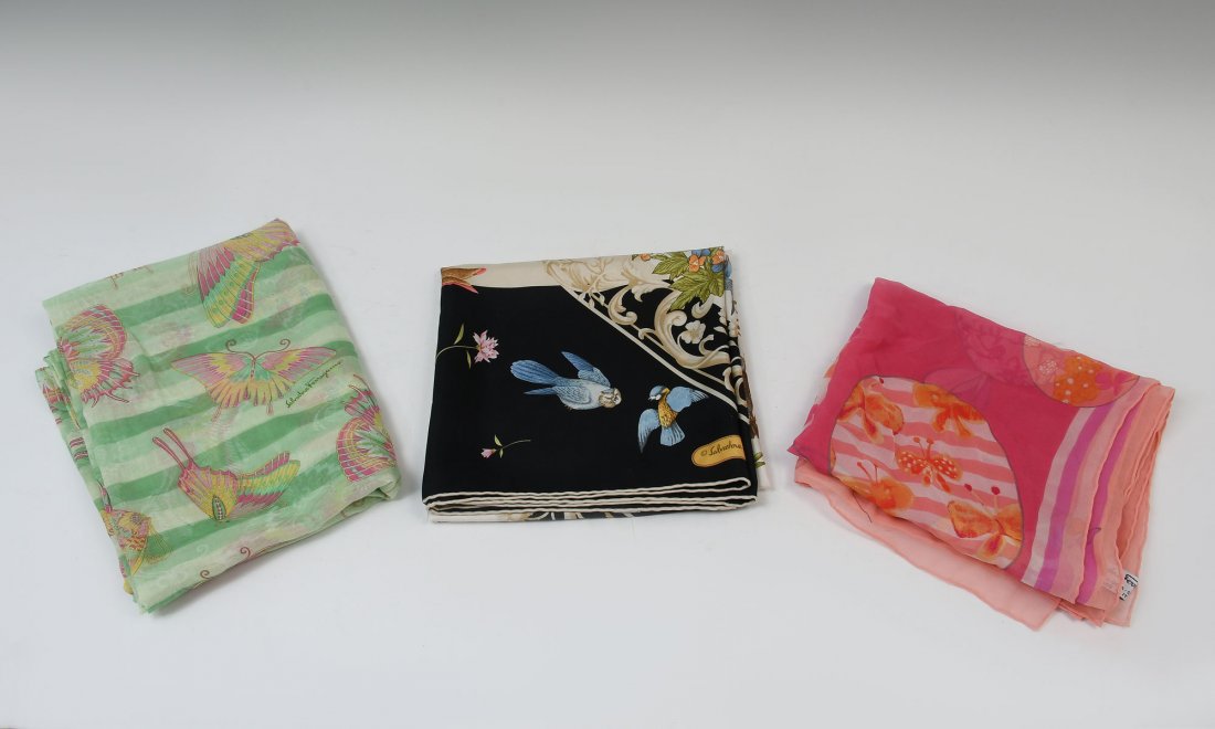 3 FERRAGAMO SCARVES: 3 FERRAGAMO SCARVES: 1) Colorful and lightweight pink & green Salvatore Ferragamo butterfly wrap/scarf. Measures 58'' w x 39'' h; 2) Pink and orange multi-colored Salvatore Ferragamo scarf measures ap