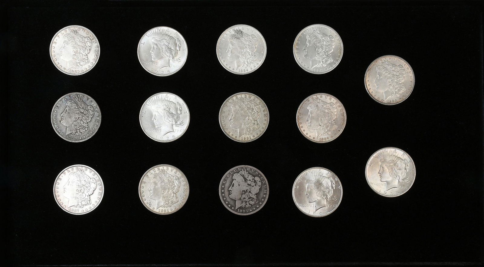 14 PC. UNITED STATES MORGAN & PEACE SILVER DOLLARS: 14 PC. UNITED STATES MORGAN & PEACE SILVER DOLLARS: 1- 1880-O, 1- 1883-0, 2- 1884-O, 1- 1887, 1- 1889, 1- 1899-O, 1-1890, 2- 1921-D, 4- 1925.