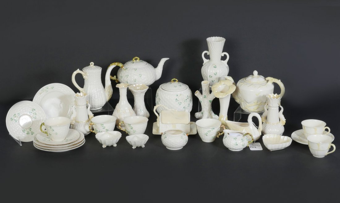 35 PC. IRISH BELLEEK PORCELAIN COLLECTION: 35 PC. IRISH BELLEEK PORCELAIN COLLECTION: Comprising; tea & coffee pots, Cups, Saucers, Bread plates, Heart & Shell form trinket dished, Numerous vases of different shapes & patterns, Creamer, & Suga