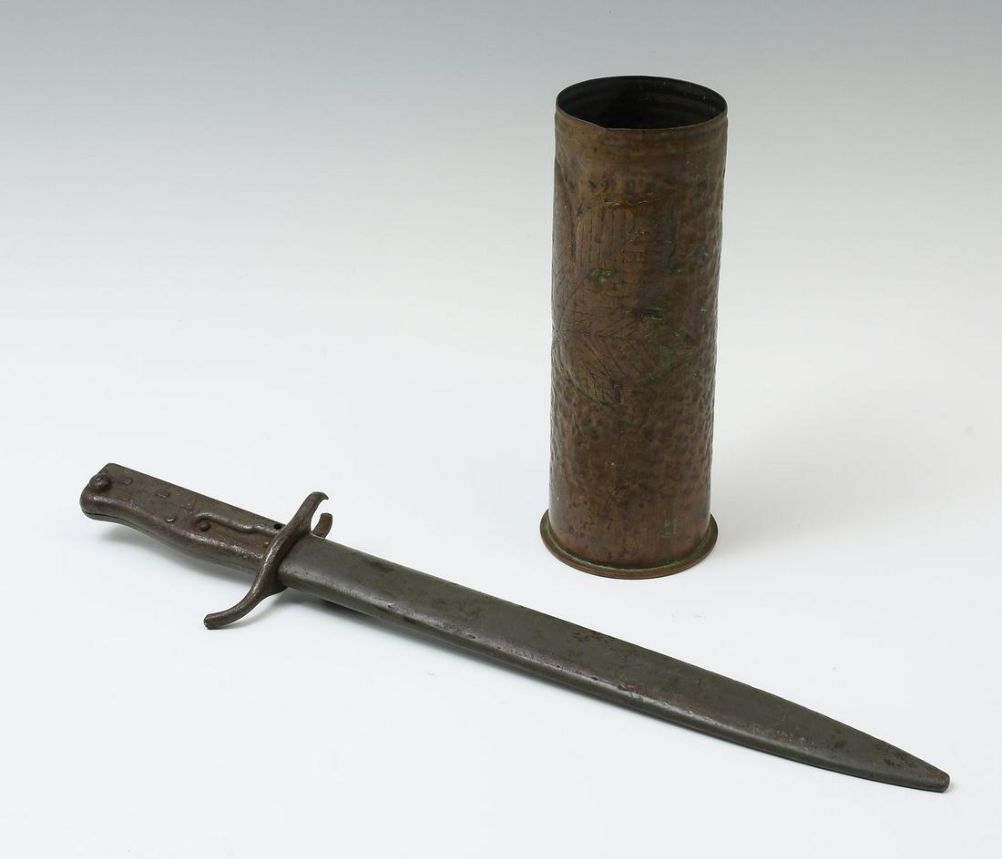 WWI ARTILLERY TRENCH ART SHELL & GERMAN BAYONET: WWI ARTILLERY TRENCH ART SHELL & GERMAN BAYONET: 1- German Ersatz bayonet with pressed steel hilt & original scabbard. 1- Artillery shell, having a uniformed soldier at the observe, and a large leaf a