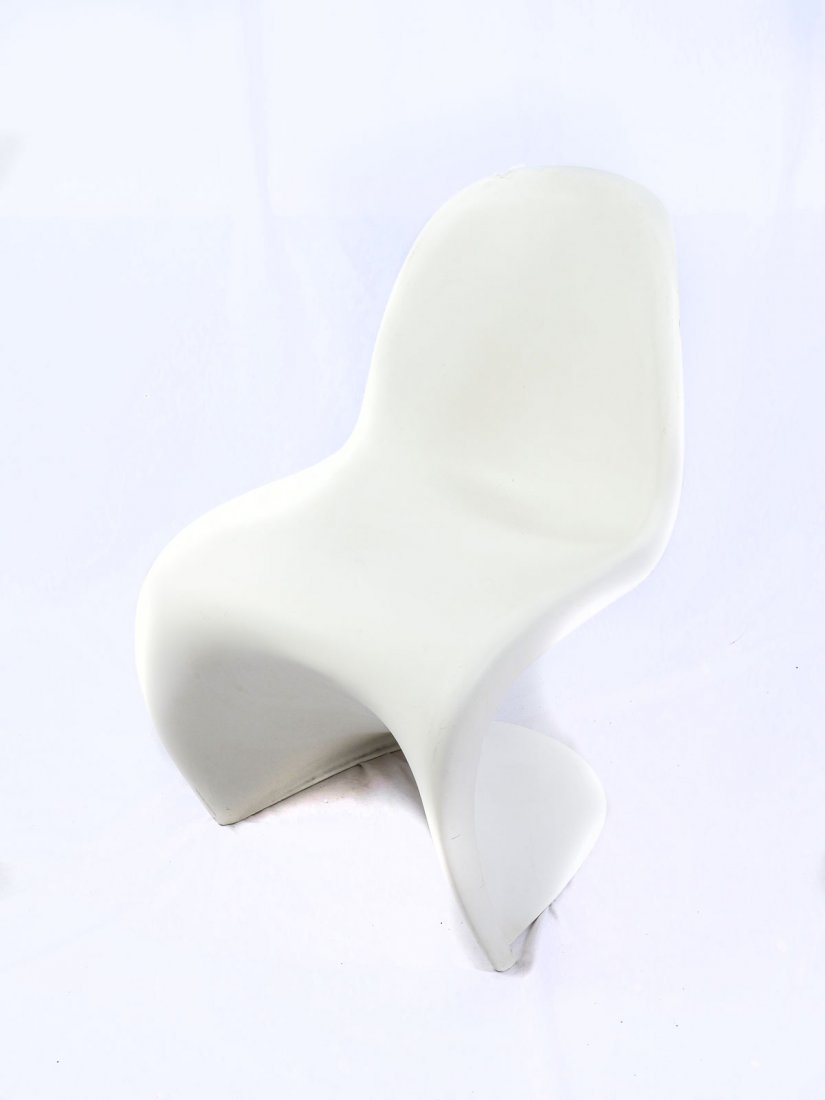 MID-CENTURY MODERN VERNER PANTON VITRA CHAIR: MID-CENTURY MODERN VERNER PANTON VITRA CHAIR: White Panton chair, introduced in 1967, by Vitra. Signed in molding, Verner Panton. Approx. 32.5" h x 19.5" l x 23.75" w.