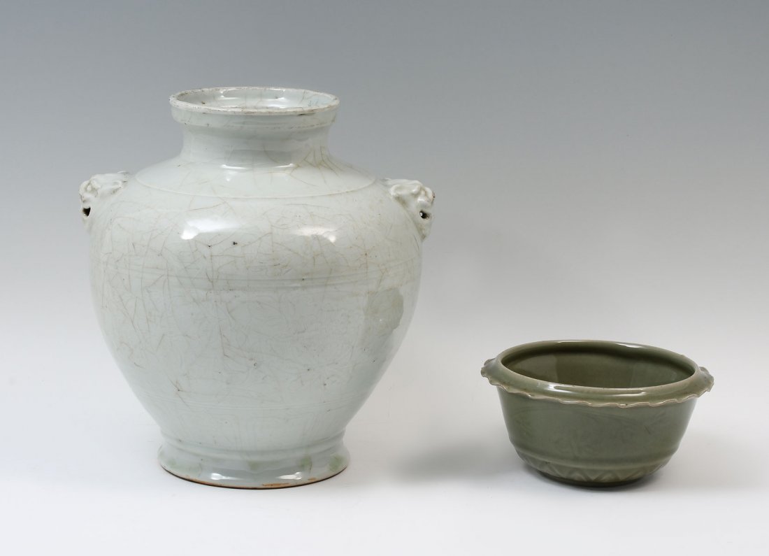 2PC. CELADON GLAZED CHINESE PORCELAIN VASE & BOWL: 2 PC. CELADON GLAZED CHINESE PORCELAIN: Comprising; 1- Baluster vase with stylized Foo Dog handles, having an encompassing incised foliate design. 1- Ming dynasty olive green bowl, having incised lotu