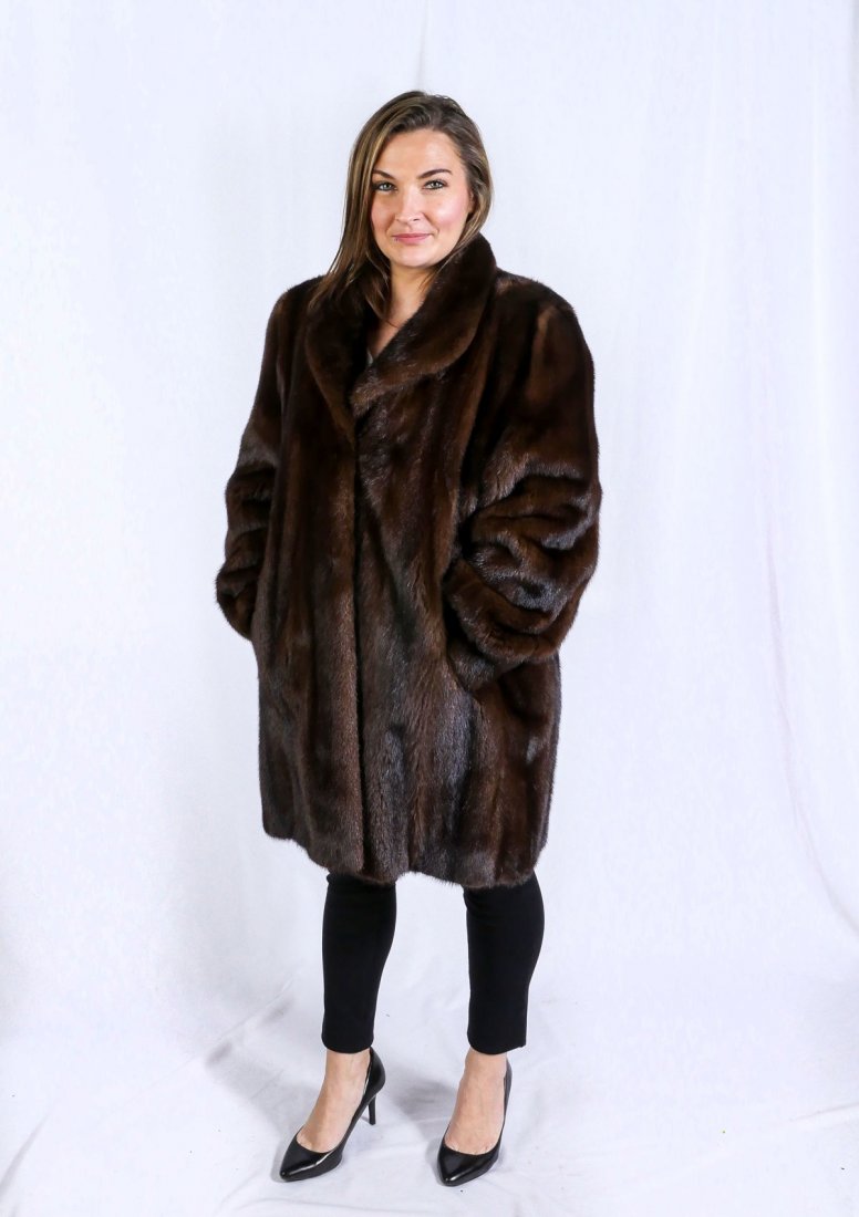 THREE QUARTER LENGTH DARK BROWN MINK COAT: THREE QUARTER LENGTH DARK BROWN MINK COAT: Well cared for .75 length mink coat has 3 closures down the front and 2 side slit pockets. Lining is in very good condition. Approx size 12. Measures approx