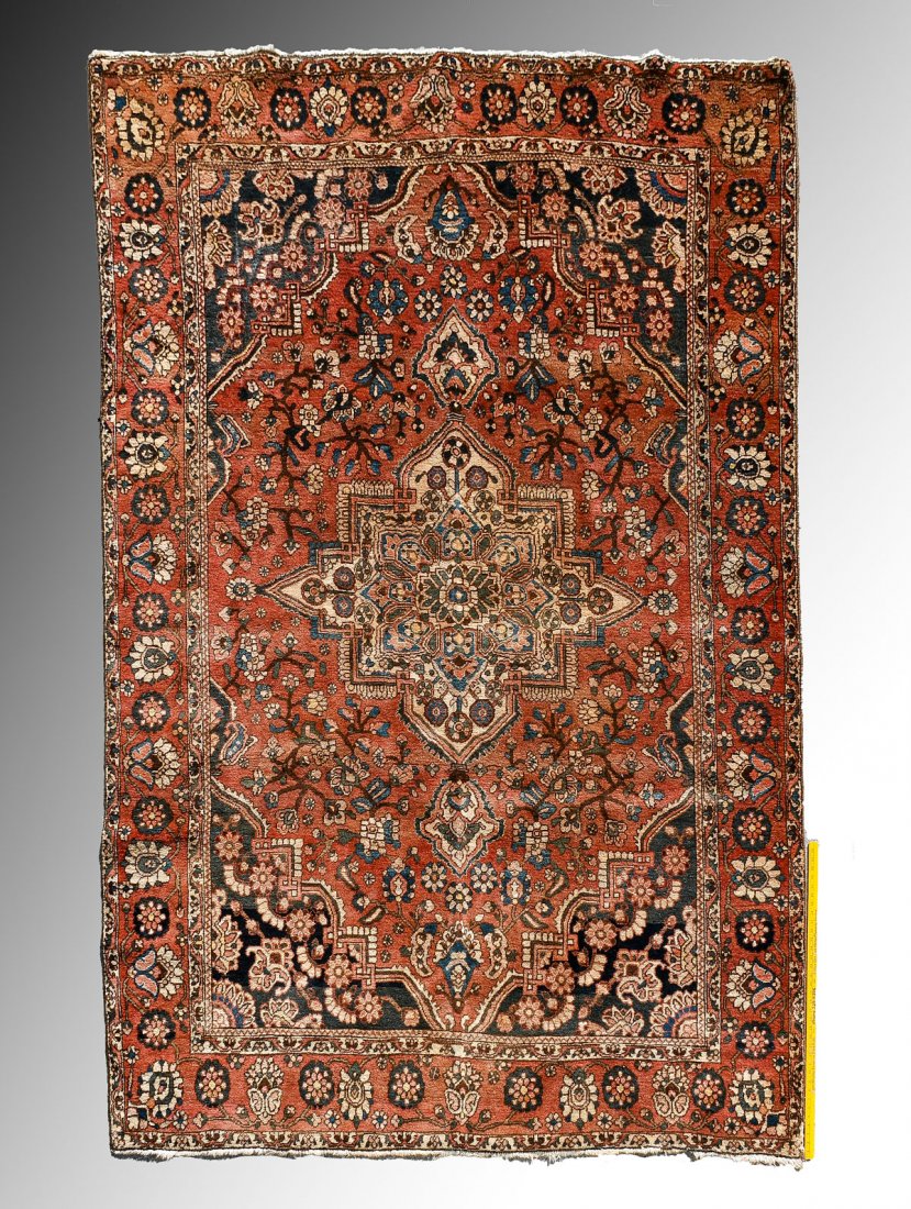 PERSIAN HK WOOL RUG, 6'10" X 10': PERSIAN HAND KNOTTED WOOL RUG, 6'10" X 10': This rug has an ivory colored central medallion and spandrels on a rust colored field with blue/black corners. Some color run and fade and one side needs so