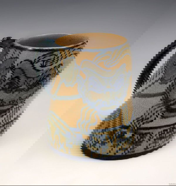 NEWCOMB COLLEGE POTTERY MUG GERTRUDE ROBERTS SMITH: NEWCOMB COLLEGE POTTERY MUG: Decorated by Gertrude Roberts Smith, faculty member art instructor at Newcomb College 1887-1894. NC impression visible, G.R.S. under glaze, 4 1/2'' tall. ''Many A Sip Neve