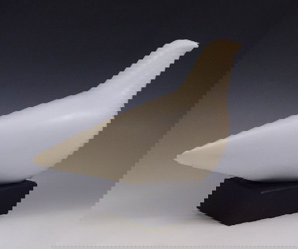 CLEO HARTWIG WHITE DOVE SCULPTURE: HARTWIG, Cleo, (American, 1911-1988): Sculpture of White Dove, White Resin, 7"h x 10"w, incised signature.