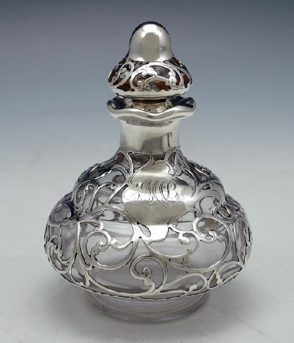 GORHAM SILVER OVERLAY SCENT BOTTLE: Marked Gorham: GORHAM SILVER OVERLAY SCENT BOTTLE: Marked Gorham Mfg. Co., R1824, etched 5F on stopper. Monogrammed. 4 1/2'' x 3 1/4'' dia.