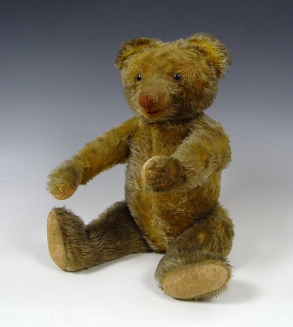 EARLY MUSICAL TEDDY BEAR Farnell : EARLY MUSICAL TEDDY BEAR: The music is of the stop and go type and plays with every movement of his head. Mohair with amber and glass eyes, thread defined snout and red thread mouth, pad feet and paws