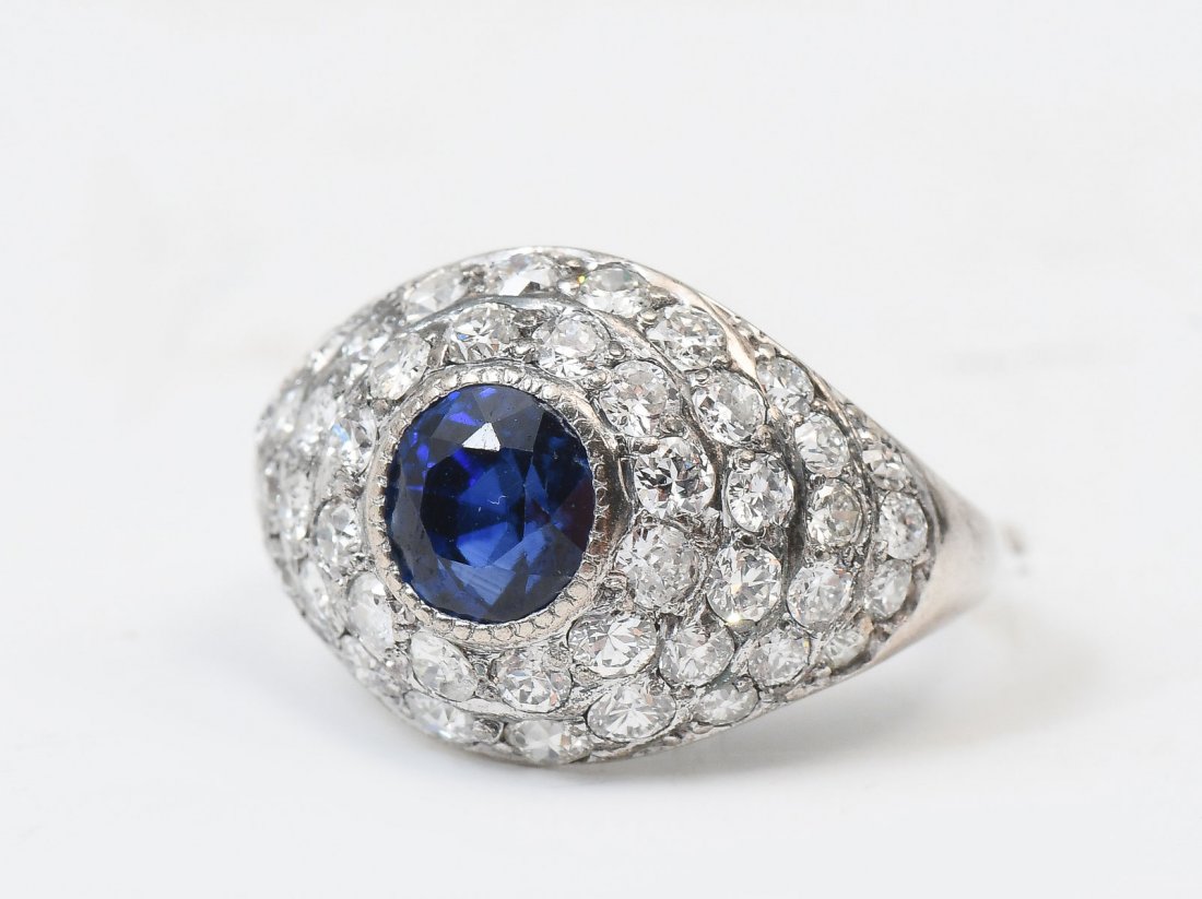 18K EDWARDIAN 2.0 CTW SAPPHIRE & DIAMOND DOME RING: 18K EDWARDIAN 2.0 CTW SAPPHIRE & DIAMOND DOME RING. Ca 1903 Edwardian style diamond and sapphire dome ring. The round native cut sapphire approx 1.57 CT complimented by 48 round brilliant cut diamonds