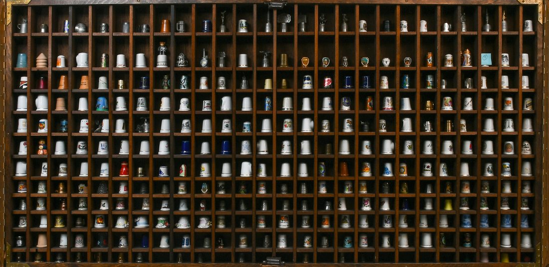 WORLD CLASS 300 PC. THIMBLE COLLECTION: WORLD CLASS 300 PC. THIMBLE COLLECTION: A very interesting collection of 300 Thimbles, comprised of; Silver, porcelain, coal, brass, cloisonne, plastic, pewter, wood, & Murano glass. All reside in a s