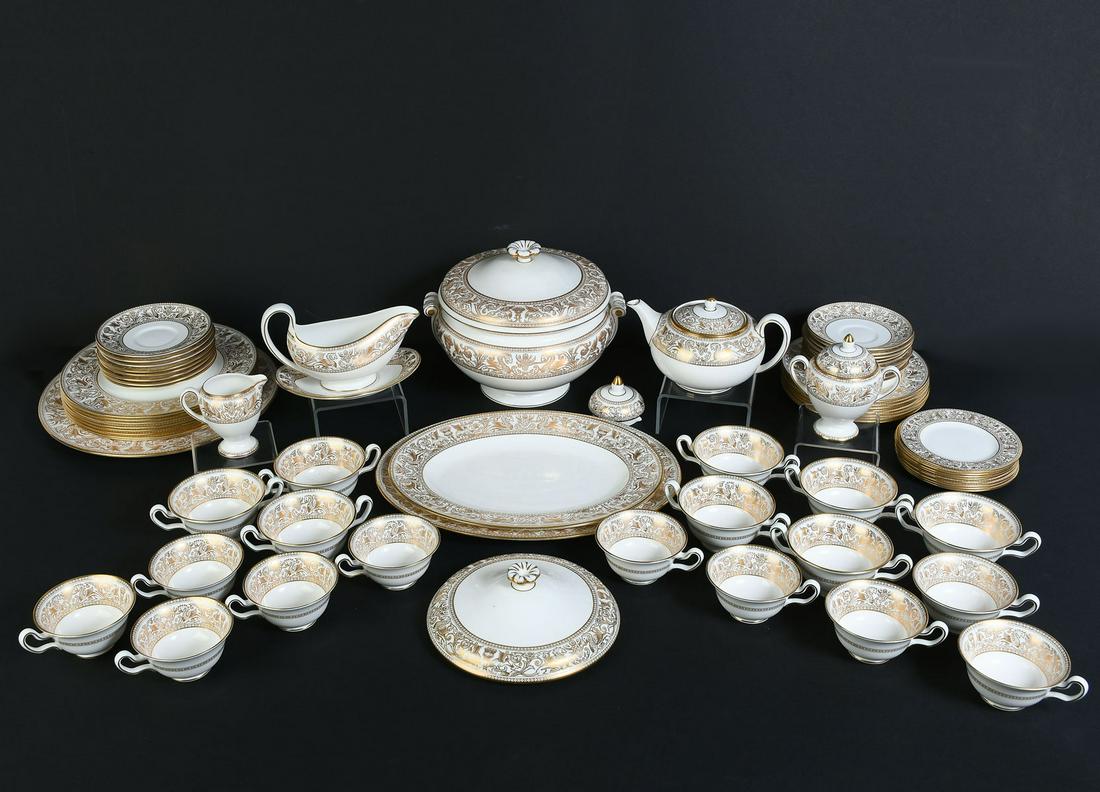 WEDGEWOOD "GOLD FLORENTINE" CHINA SET: WEDGEWOOD "GOLD FLORENTINE" CHINA SET: Comprising; 10- Tea cups, 8- Soup cups, 2- Oval platters, 1- Covered veggie dish, 1- Round platter, 8- Dinner plates, 1- Gravy bowl, 1- Gravy underplate, 1- Suga