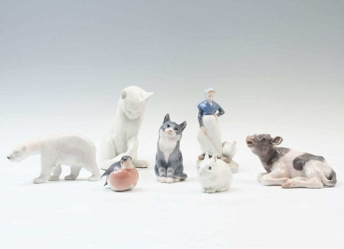 7 PC. ROYAL COPENHAGEN FIGURINES: 7 PC. ROYAL COPENHAGEN PORCELAIN FIGURINES: Comprising; 1- Large cat, 1- Cow, 1- Polar bear, 1- Smaller cat, 1- Robin, 1- Rabbit, & 1- Maiden with Goose. All with appropriate marks at undersides. Larg