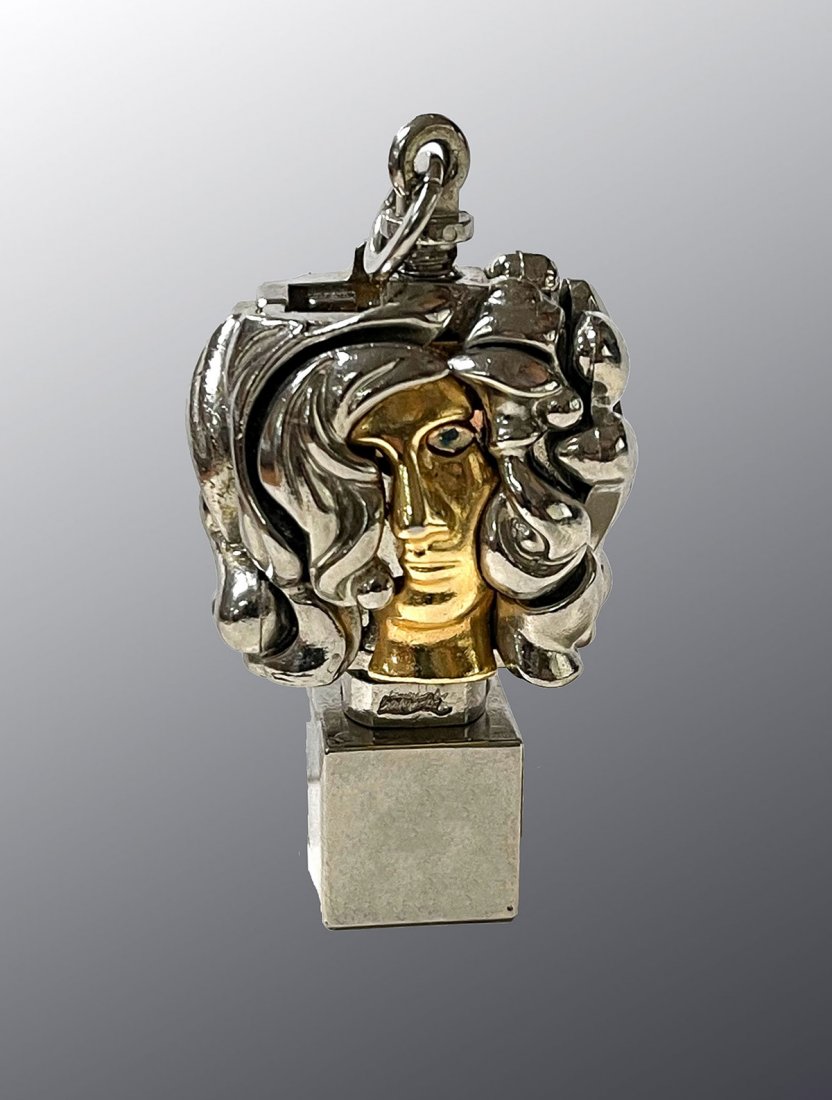 MIGUEL BERROCAL PUZZLE PENDANT: BERROCAL, Miguel, (Spanish, 1933-2006,): Portrait de Michele, Puzzle Pendant, 2" h. Missing upper piece to puzzle.